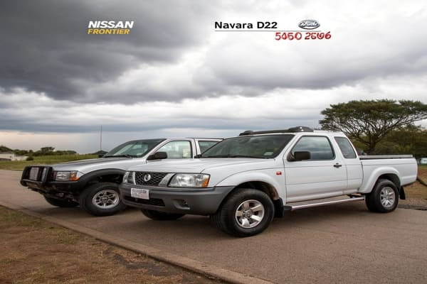 A Nissan Navara D22 parked in an industrial setting