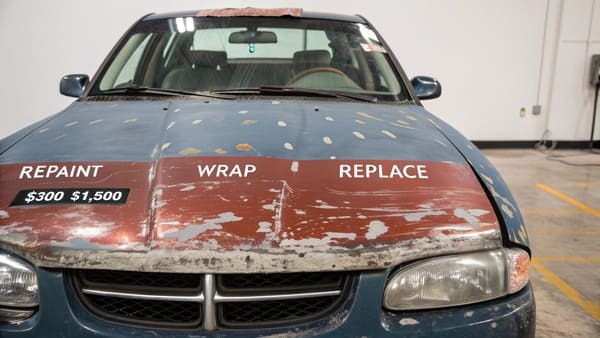 A freshly painted glossy black car hood