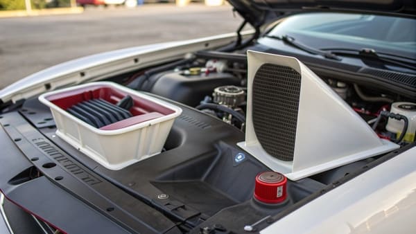 A large single hood scoop on a performance car