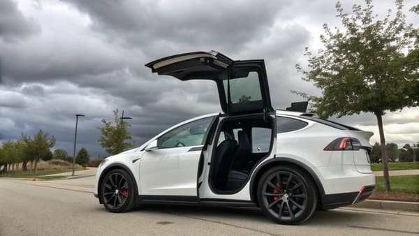 A 2017 Tesla Model X parked on a city street
