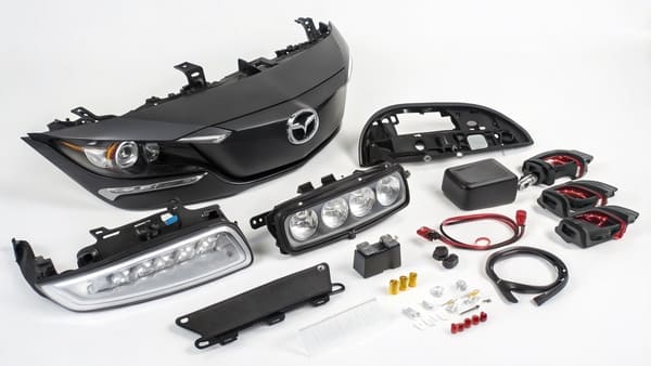 A detailed shot of a Mazda LED headlight assembly