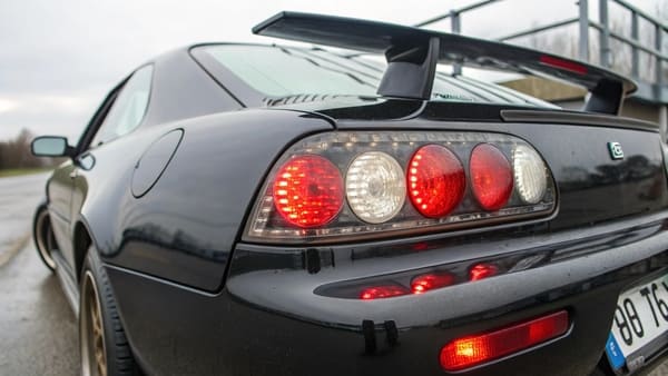 A car braking in traffic with brake lights on