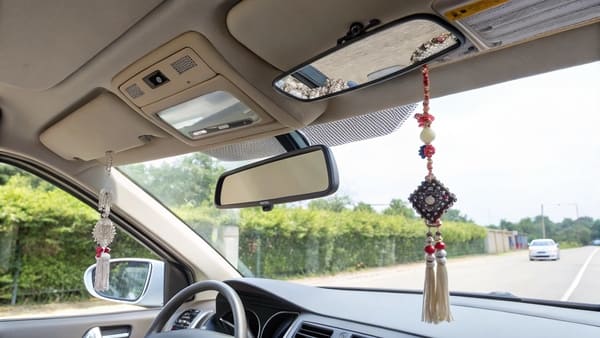 A car sun visor flipped down with the mirror cover open