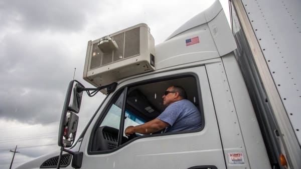 a truck with a parking air conditioner on a sunny day