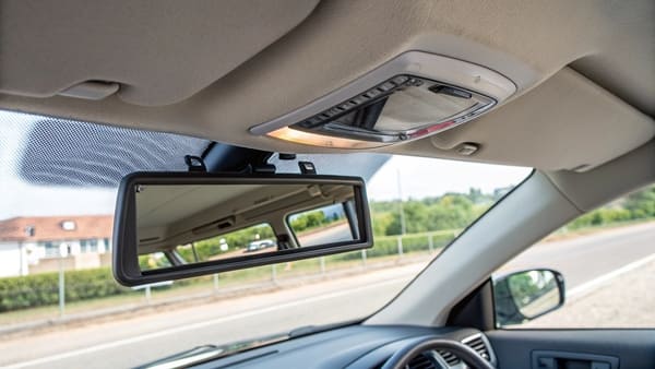 A diagram showing different names for a sun visor mirror