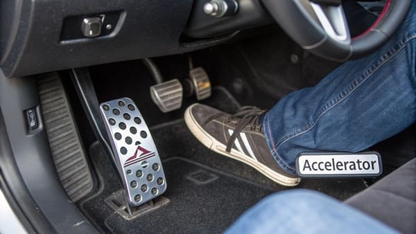 Driver's footwell showing the standard pedal layout