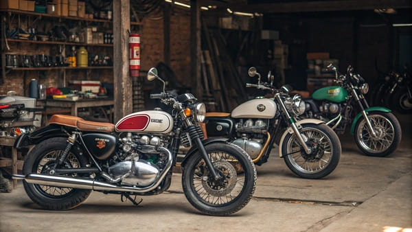 A lineup of different vintage motorcycles