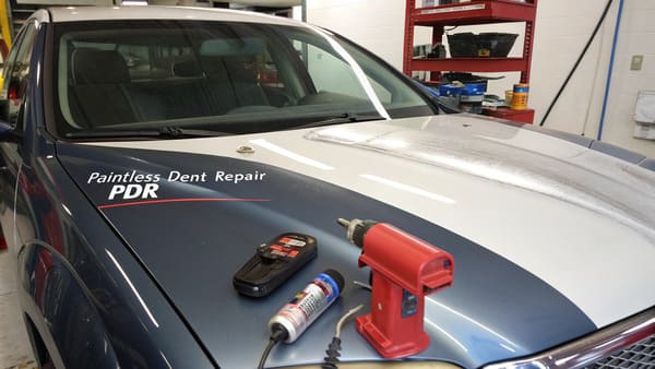 A diagram showing different types of dents on a car hood.