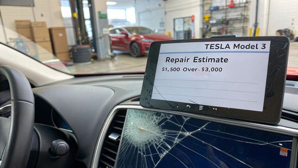 A Tesla touchscreen with a crack across it