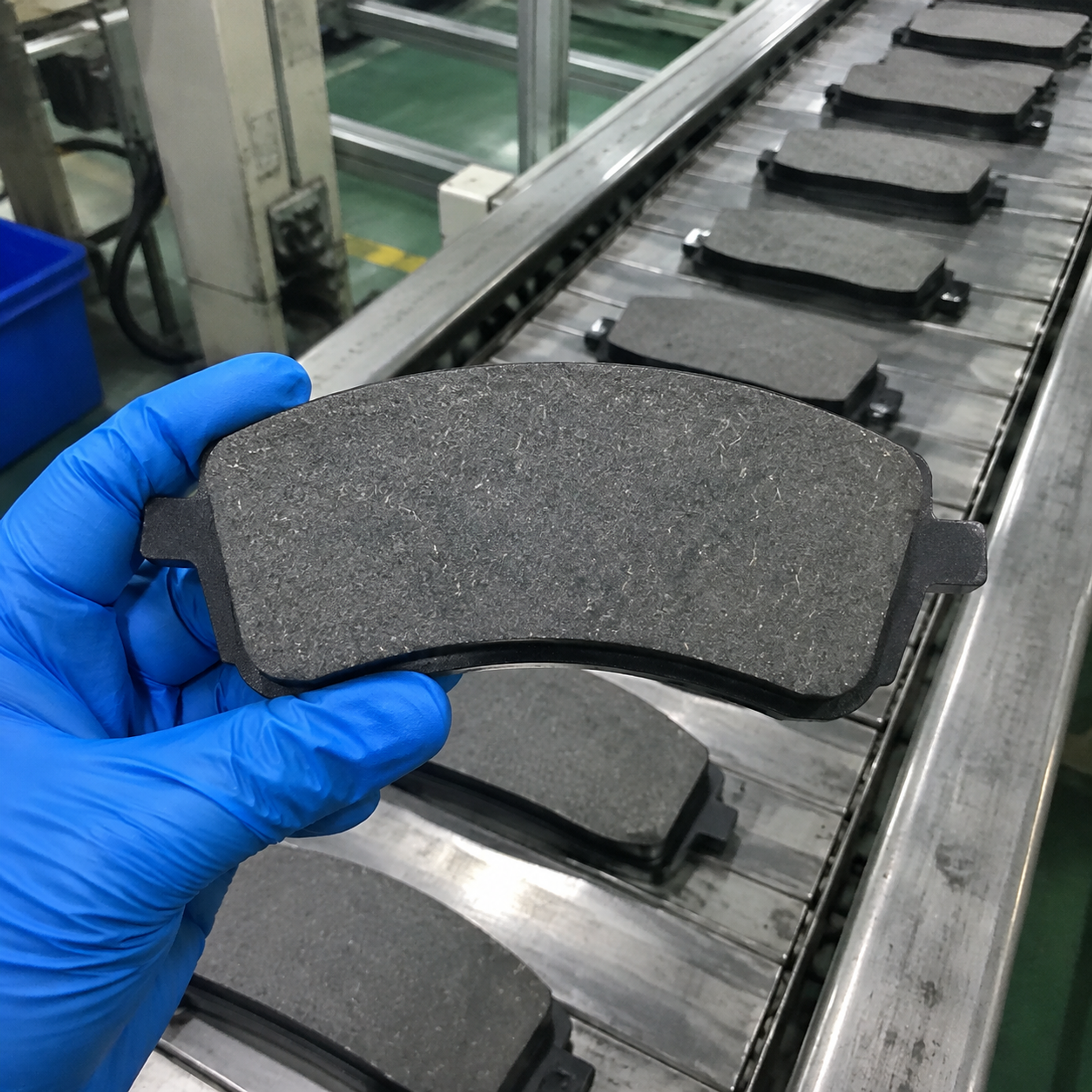 Ceramic brake pad friction material close-up Close-up of ceramic friction material on a brake pad production line